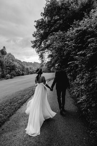 Young newlyweds. black and white, people from behind, bride and groom.