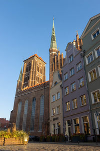 Low angle view of buildings against clear sky