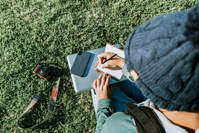 High angle view of man reading book