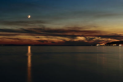 Scenic view of sea against sky at night