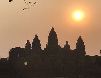 Silhouette of building against sky during sunset