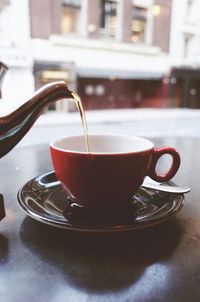 Close-up of coffee cup on table