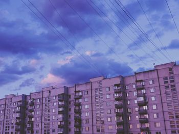 Low angle view of buildings in city against sky