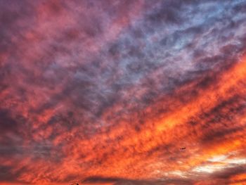 Low angle view of dramatic sky at sunset