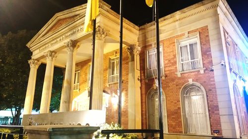 Low angle view of historic building at night