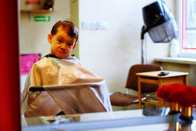 Funny boy in hair salon