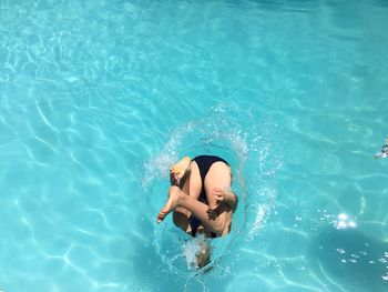 High angle view of young woman in swimming pool