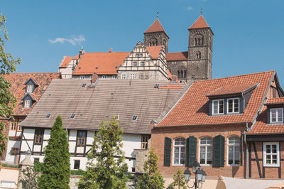 Low angle view of houses in town against sky