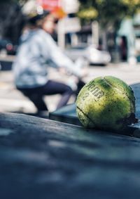 Close-up of apple on street