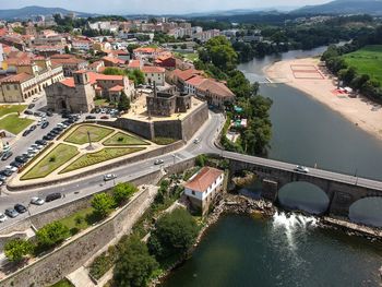 High angle view of river amidst buildings in city