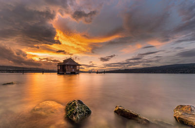 Scenic view of sea against sky during sunset