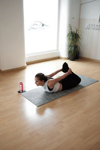 Group of women practicing pilates exercises in class