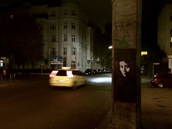 Illuminated city street at night