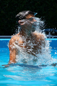 Man swimming in pool