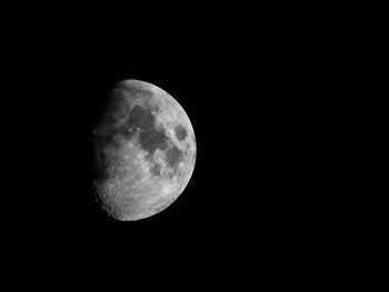 Low angle view of moon against sky at night