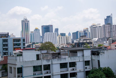 Buildings in city against sky