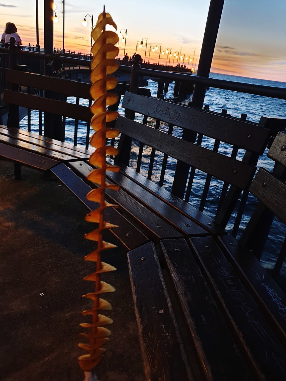 TABLES AND CHAIRS AGAINST SKY DURING SUNSET