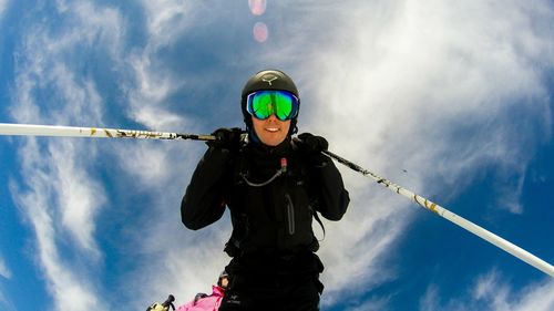 Low angle portrait of man skiing