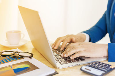 Man using laptop on table