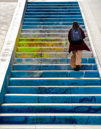 Side view of man standing on steps