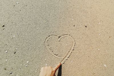High angle view of heart shape on sand
