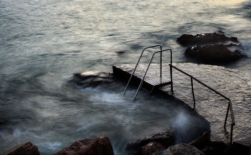 High angle view of waves in sea against sky