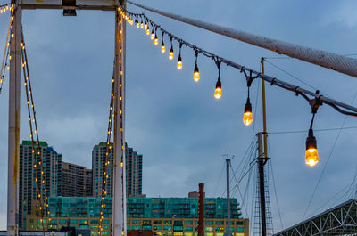 Low angle view of illuminated buildings against sky