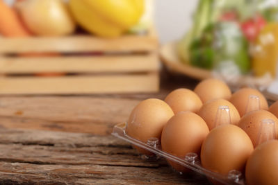 Close-up of eggs in container on table
