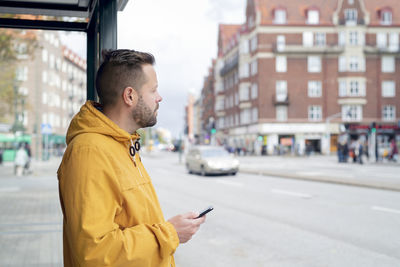 Man waiting at bus stop