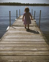 Full length of woman standing on pier