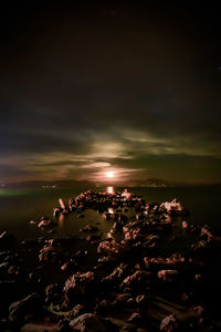 Aerial view of sea against sky during sunset