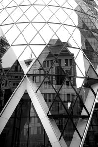 Old building reflecting in saint mary axe skyscraper, london