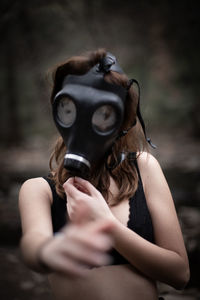 Woman wearing gas mask