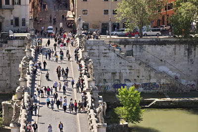 High angle view of people walking on street in city