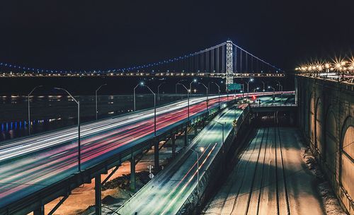 Illuminated bridge at night