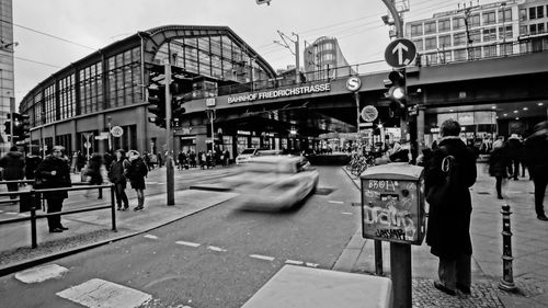 People walking on road in city