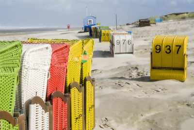 Colourful scene with beach chairs on the north sea beach on juist