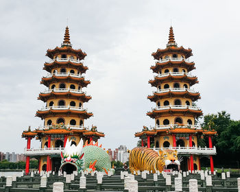 Low angle view of pagoda against building