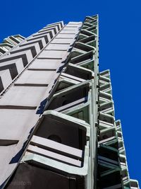 Low angle view of building against clear blue sky
