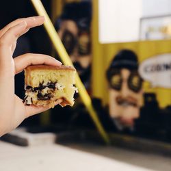 Close-up of cropped hand holding ice cream