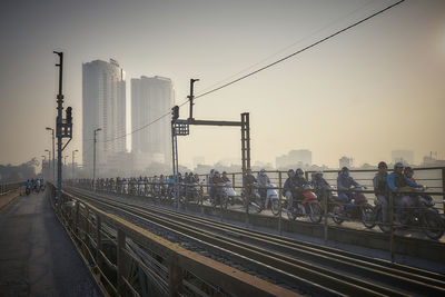 People rushing to hanoi over long bien bridge. early morning. 