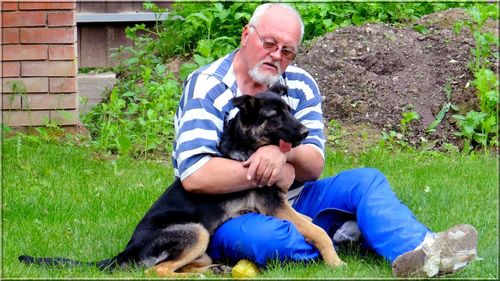 Full length of man with dog