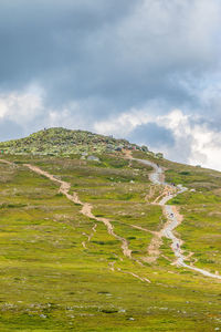 Mountain peak with trails on the mountain side