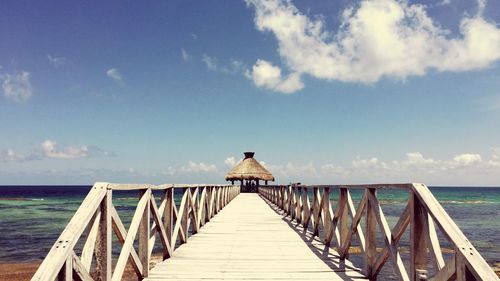 Pier over sea against sky