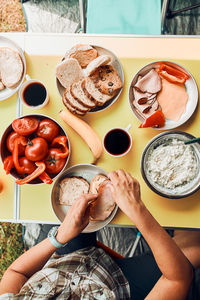 Breakfast prepared during summer vacation on camping. bread, cottage cheese, cold meat