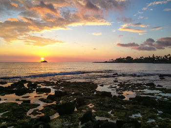 Scenic view of sea at sunset