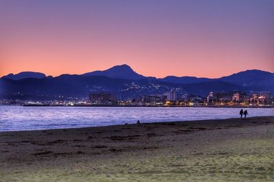 Scenic view of sea against clear sky at sunset