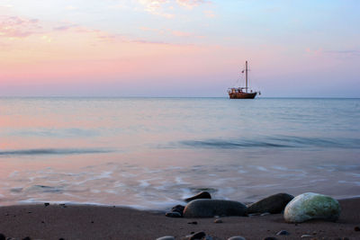 Scenic view of sea against sky at sunset