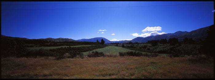 Scenic view of landscape against clear blue sky