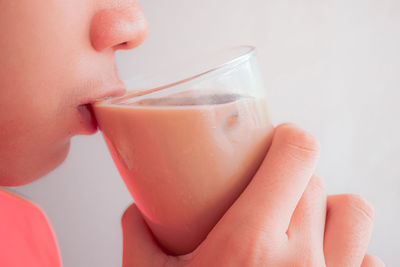 Close-up of woman hand holding drink